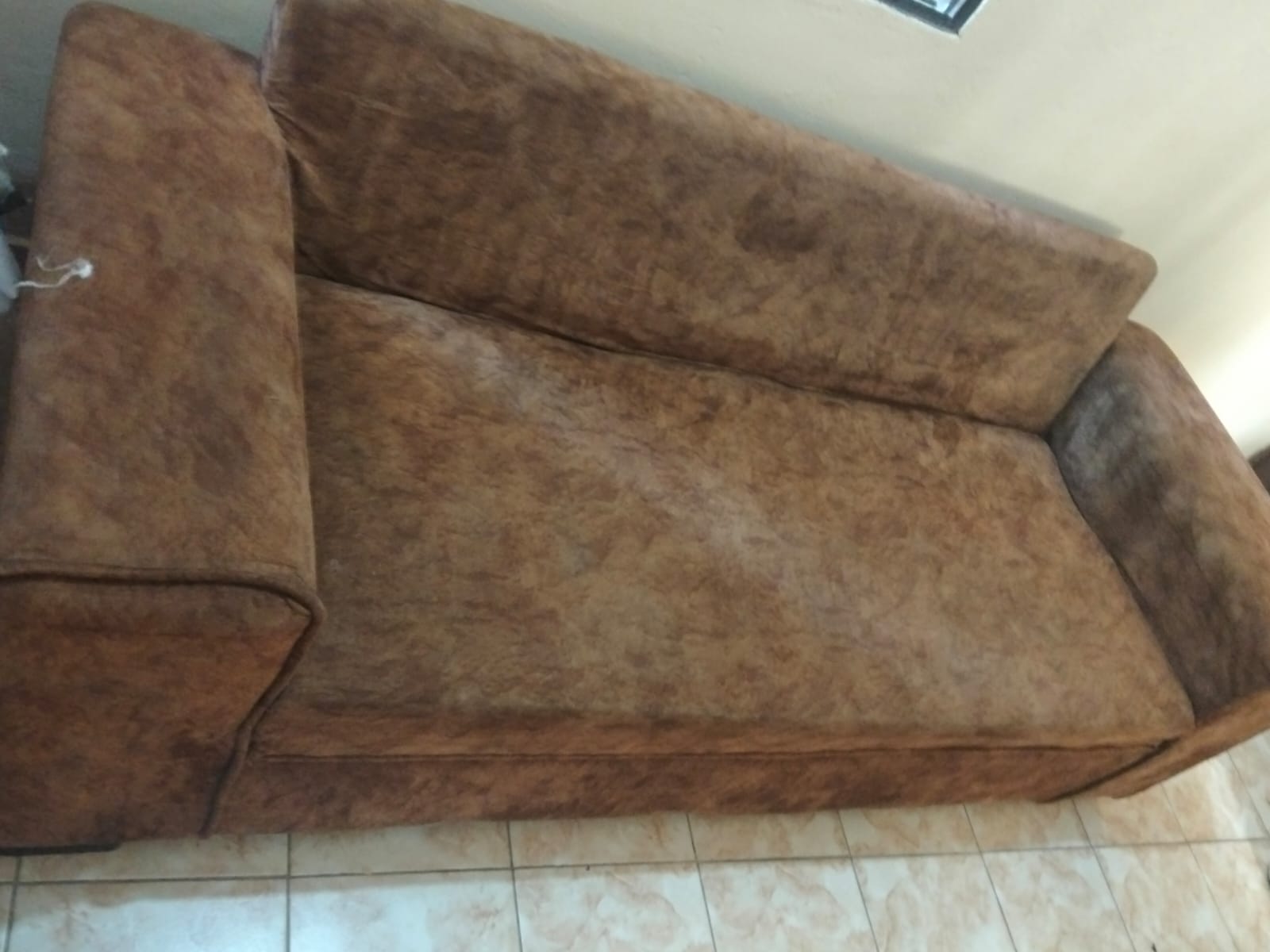 Restored gray couch showing professional cleaning results