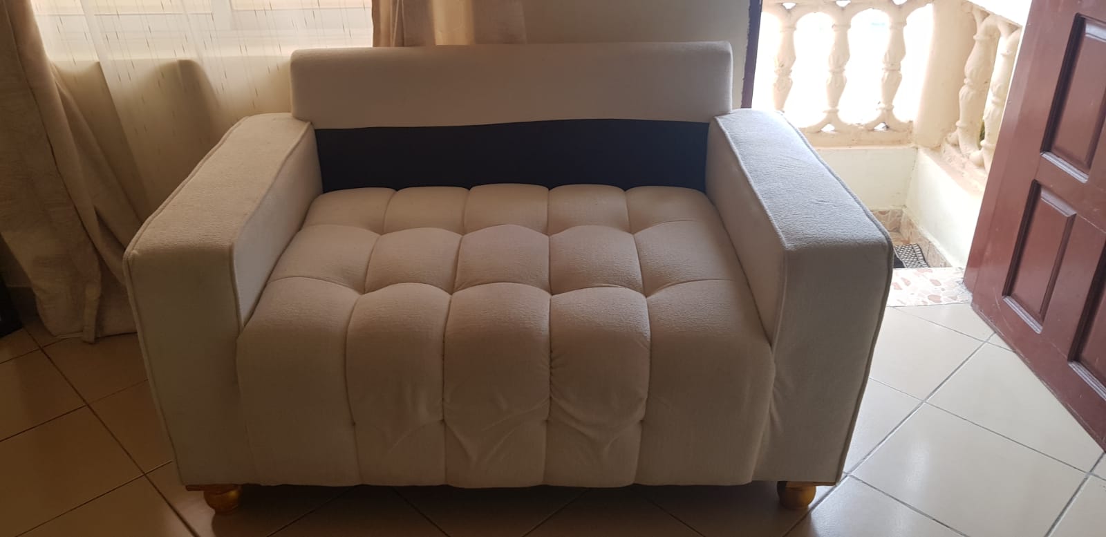 White fabric sofa after deep cleaning - home upholstery care